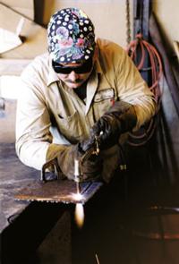 worker using an oxyfuel cutter