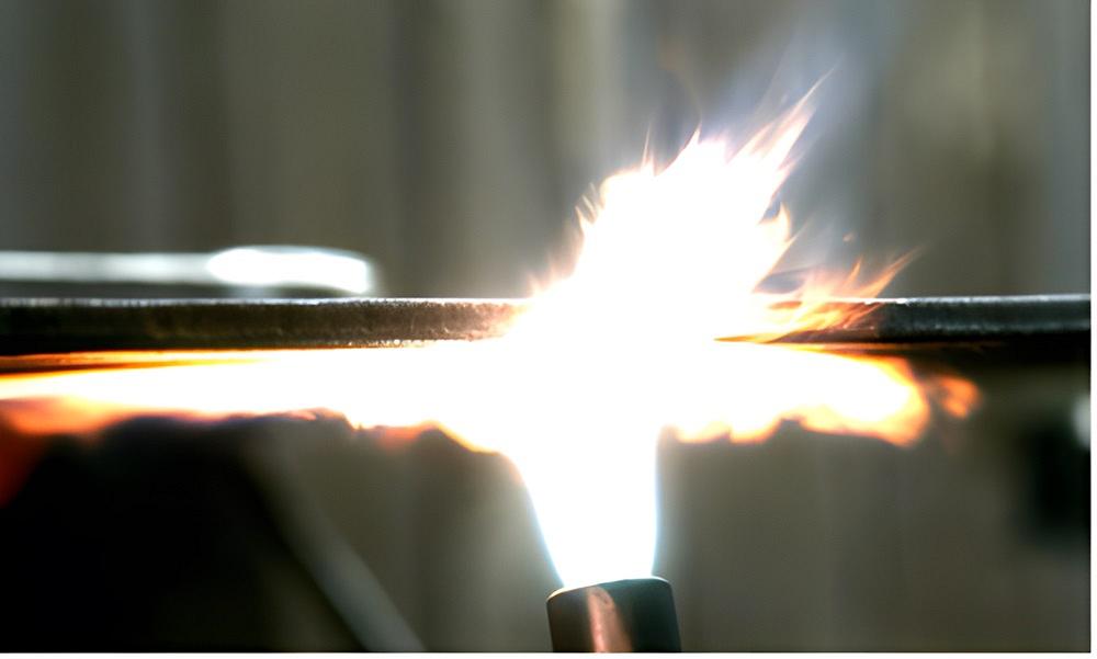 A torch heats metal.