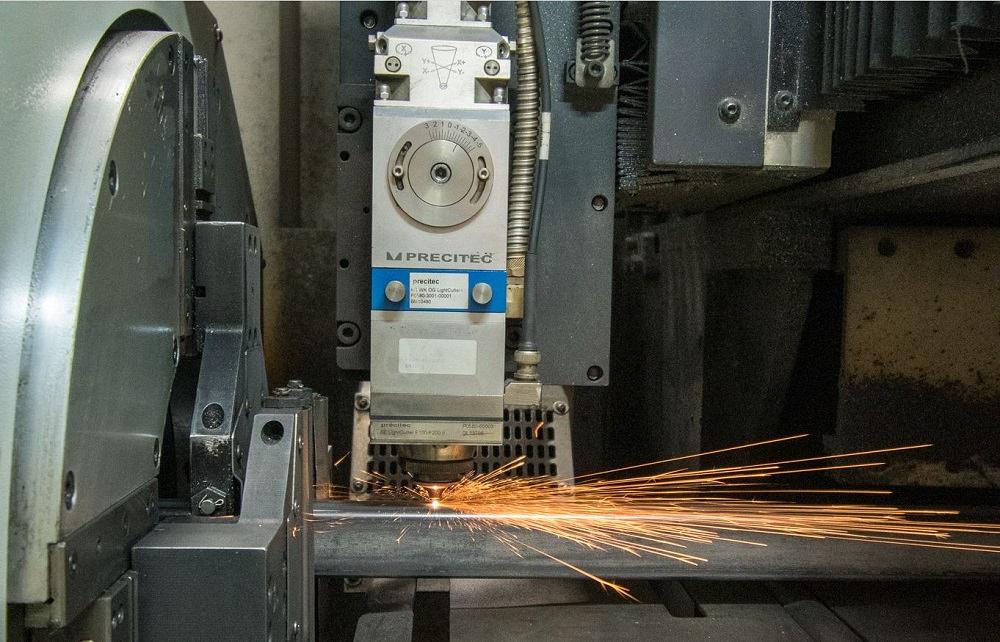 Tube laser cutting machine working in a metal fabrication shop