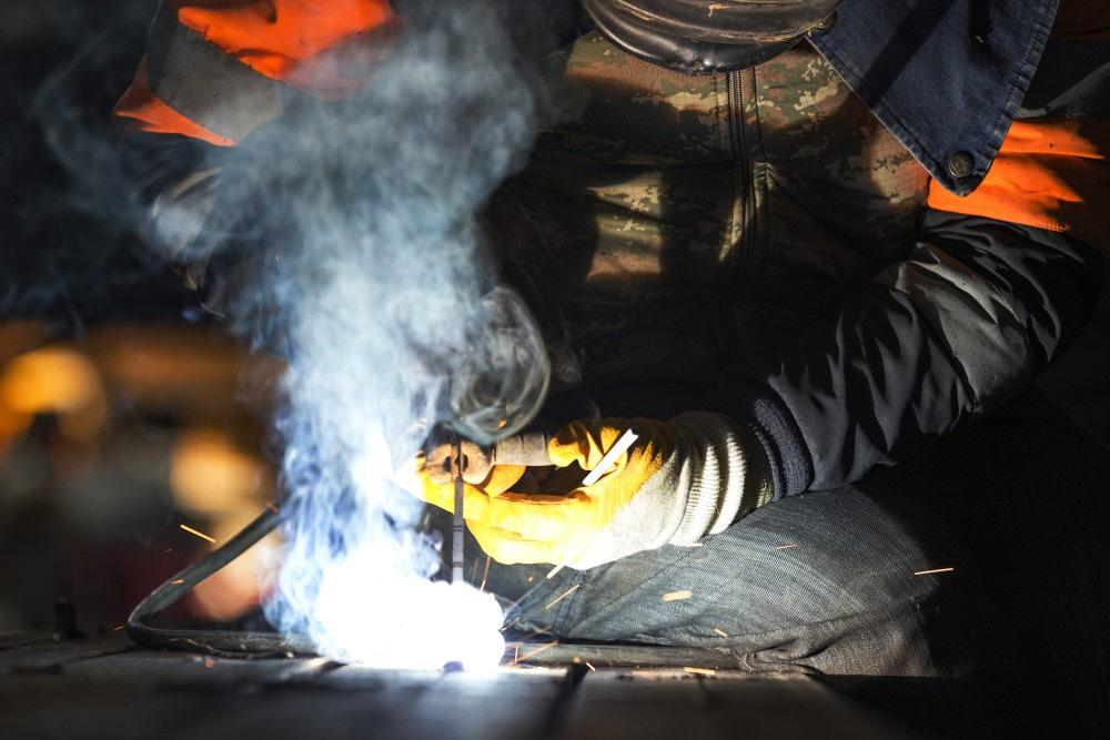 A welder is welding with shielded metal arc welding, manual metal arc welding or stick welding.