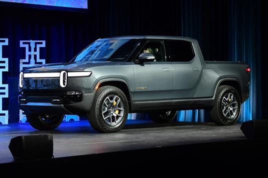 Rivian cuts 2022 production estimates in half