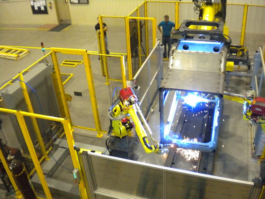 material handling robot places weldment for welding robots