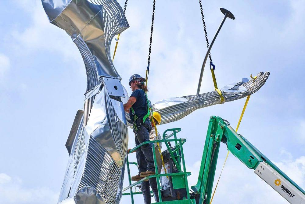 Metal artist Jack Howard-Potter building a sculpture of wide receiver Raymond Berry and the 1958 NFL Championship Game