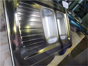 Stainless steel sink with a stamped finish