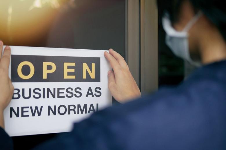 Business owner puts up sign amid coronavirus pandemic 
