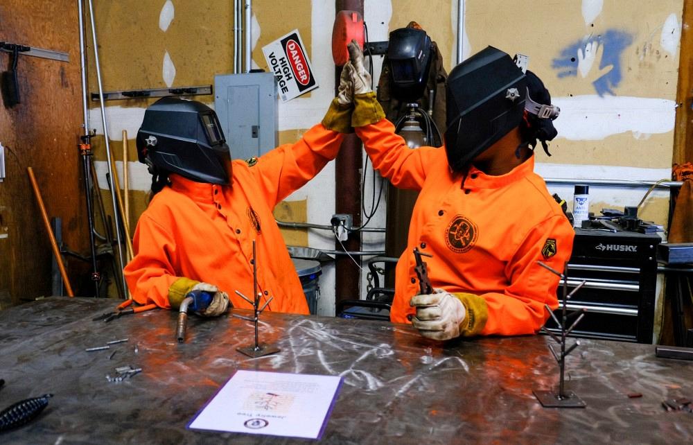Students participate in a welding class.