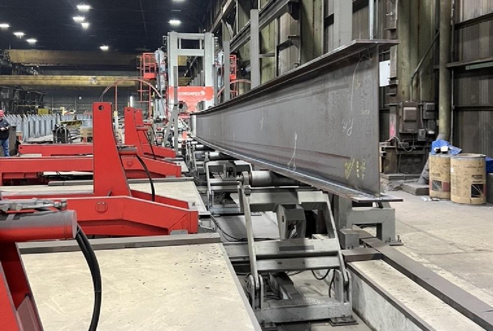 Vertical beam welding in custom structural beam fabrication