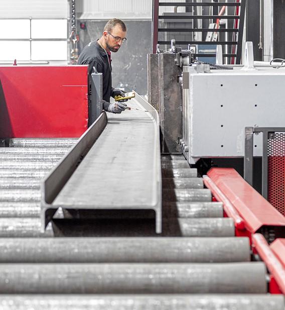 Chambering Machine Structural beam cambering with throughput in mind