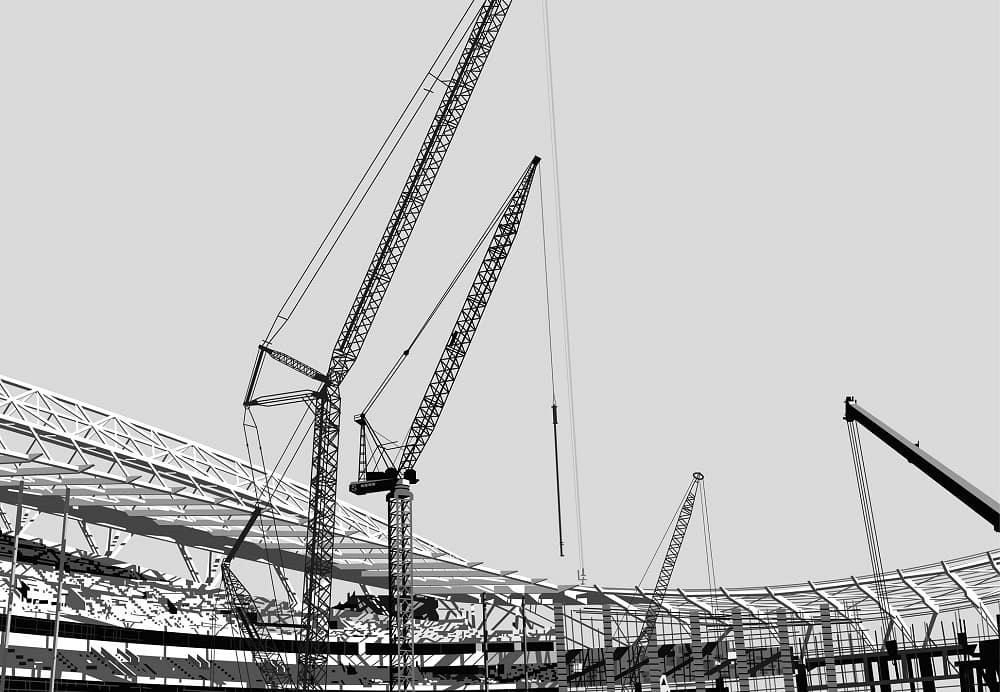 Construction of a stadium with cranes and steel beams