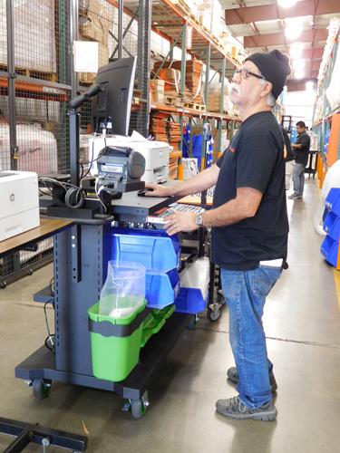 Newcastle Systems customer Direct Relief uses a mobile powered workstation in its Santa Barbara, Calif., warehouse.