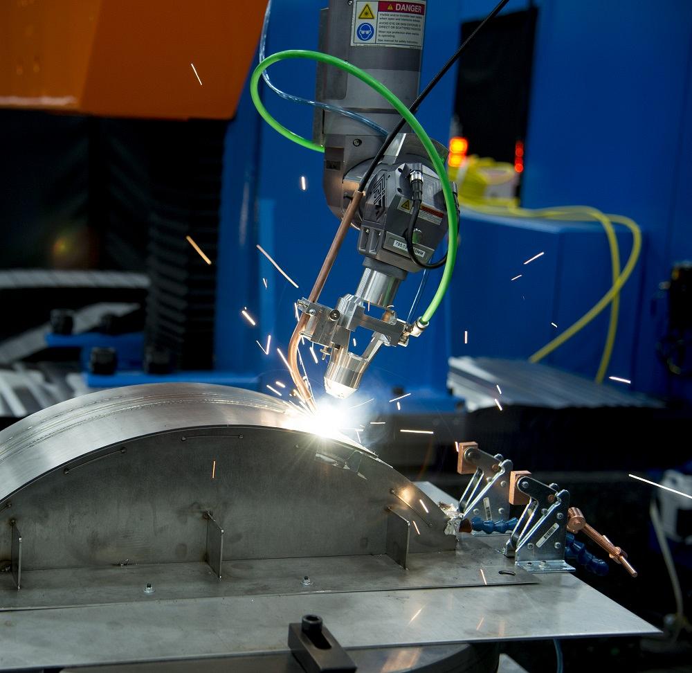 A laser is used to weld an aerospace component.