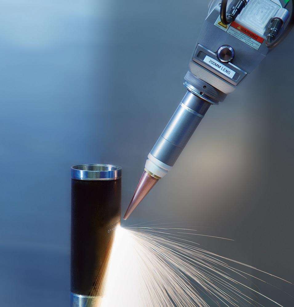 A laser drills a hole at a shallow angle to the surface.