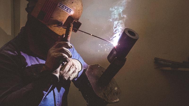Pipe welding student stick welding
