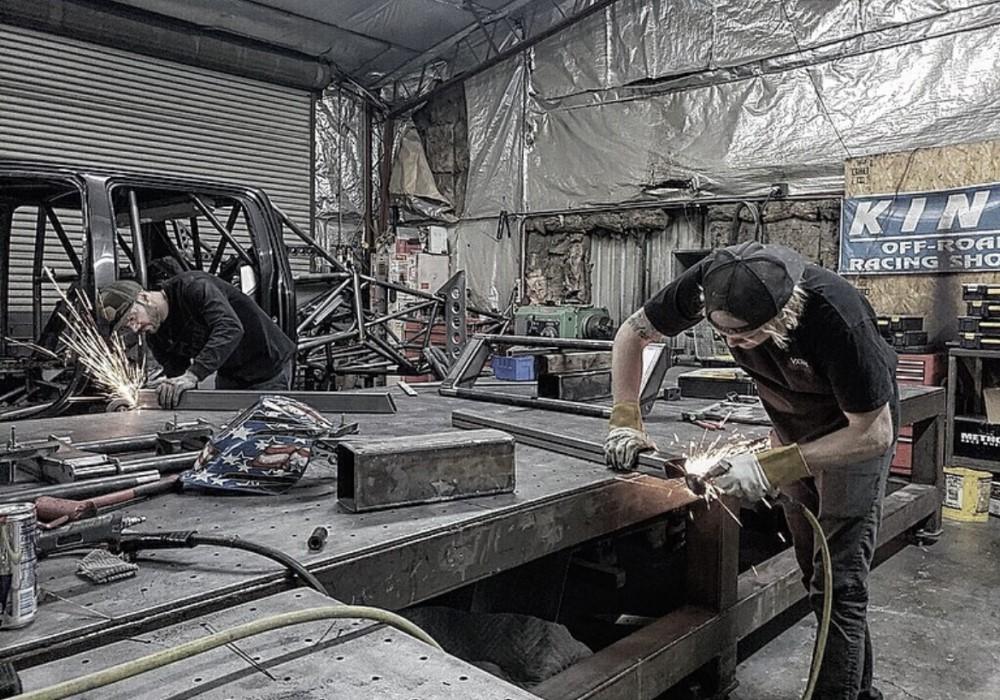 Metal fabricator working in his shop.