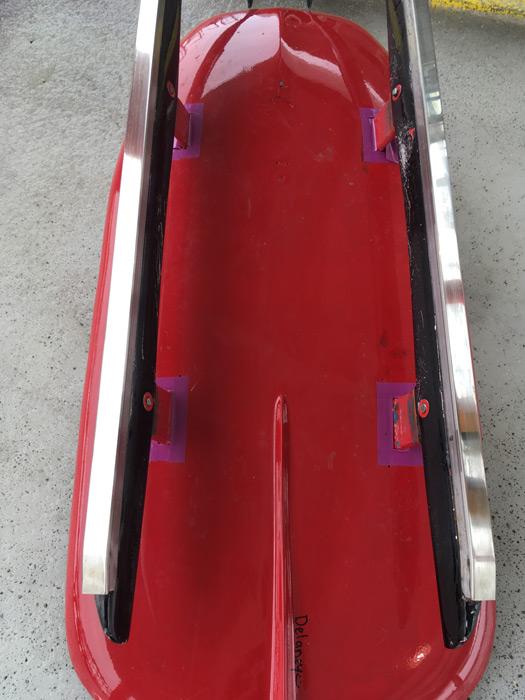 The steel blades of a luge sled