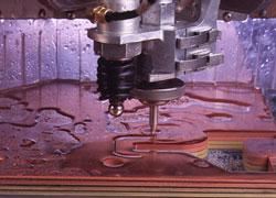 Waterjet cuts stacked material