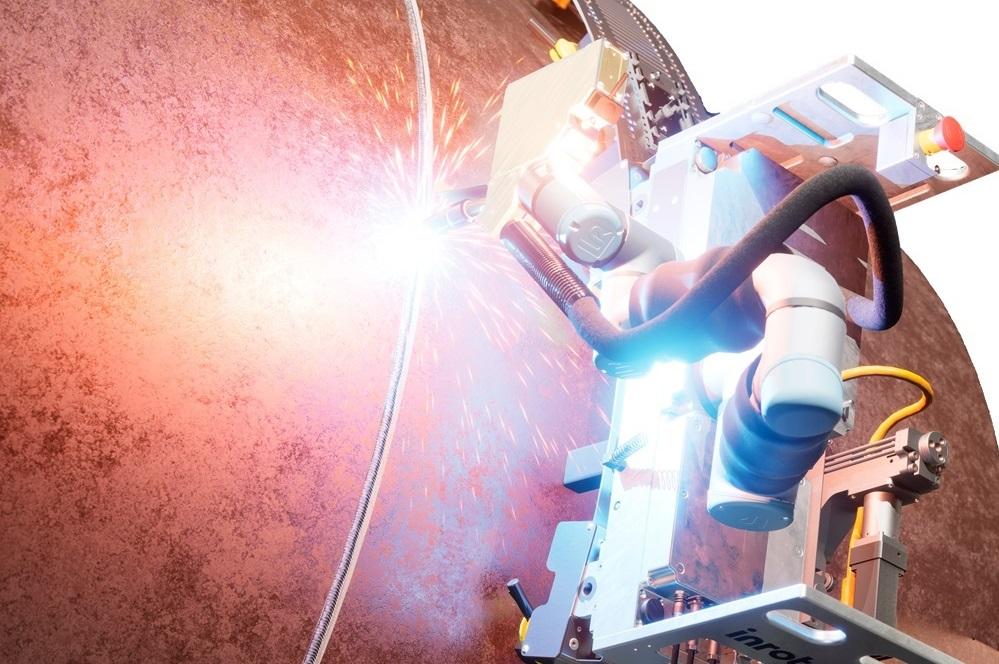 A cobot welds while in motion.