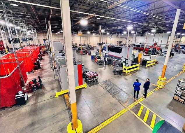 An overhead view of a manufacturing shop floor is shown.