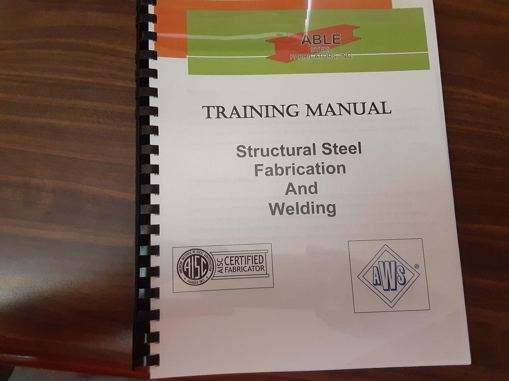 The Able Steel Training Manual is shown.