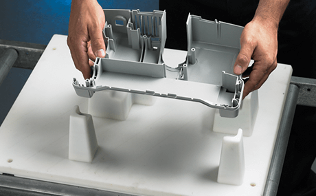 Hands assembling 3D printed parts