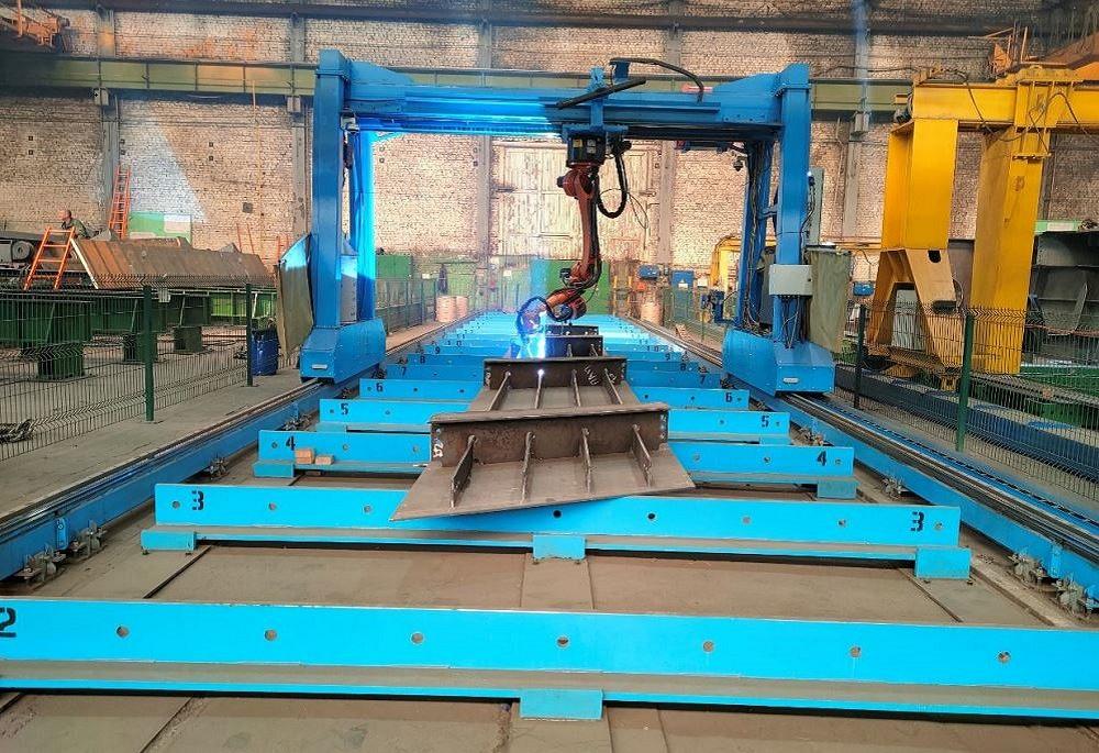 metal fabrication shop with welding robots